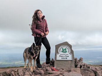 Sarah with her dog on top of Pen y Fan. 