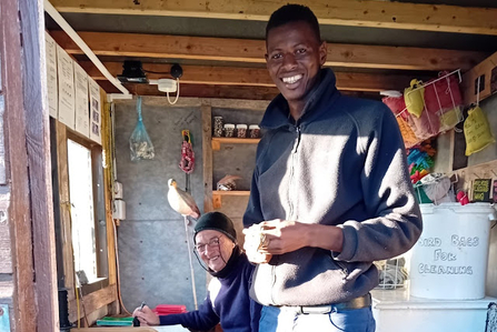 A man ringing a bird. 