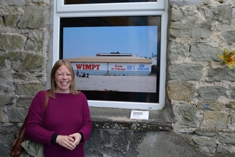 Jo stood outside a building.