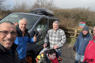 Lads and Dads visiting Parc Slip with child in wheelchair