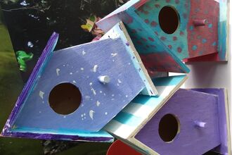 3 small painted bird houses