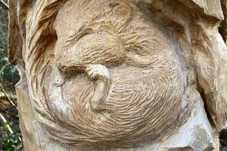 Wooden doormouse sculpture at Gelli Hir